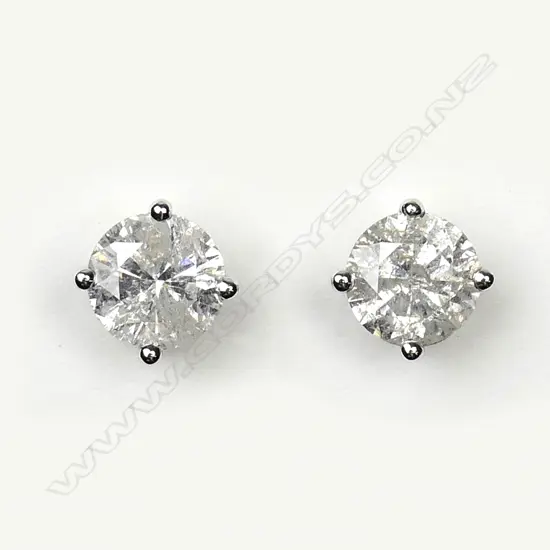 A pair of 14ct white gold and diamond stud earrings