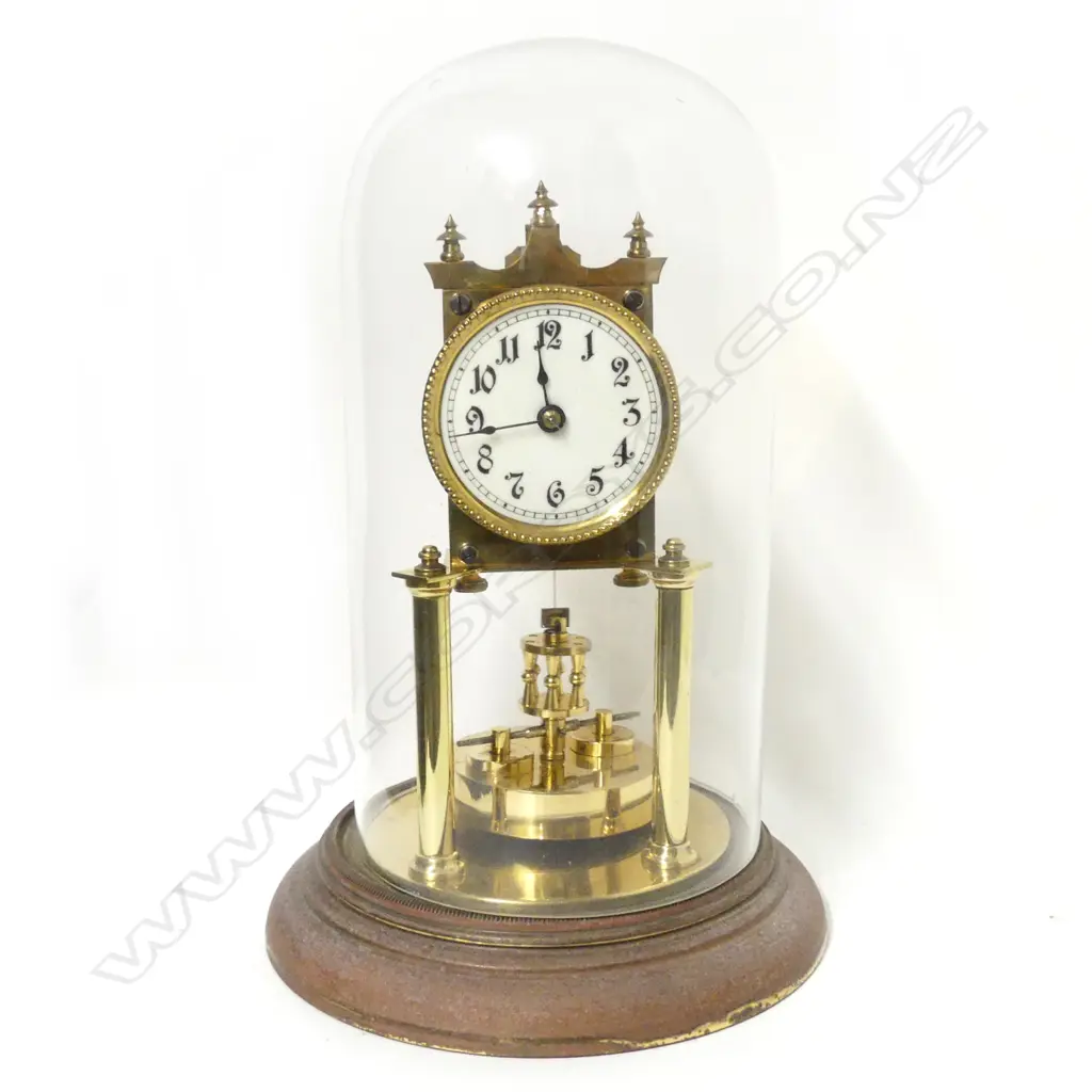 A brass 400-day torsion clock with glass dome Image 1++