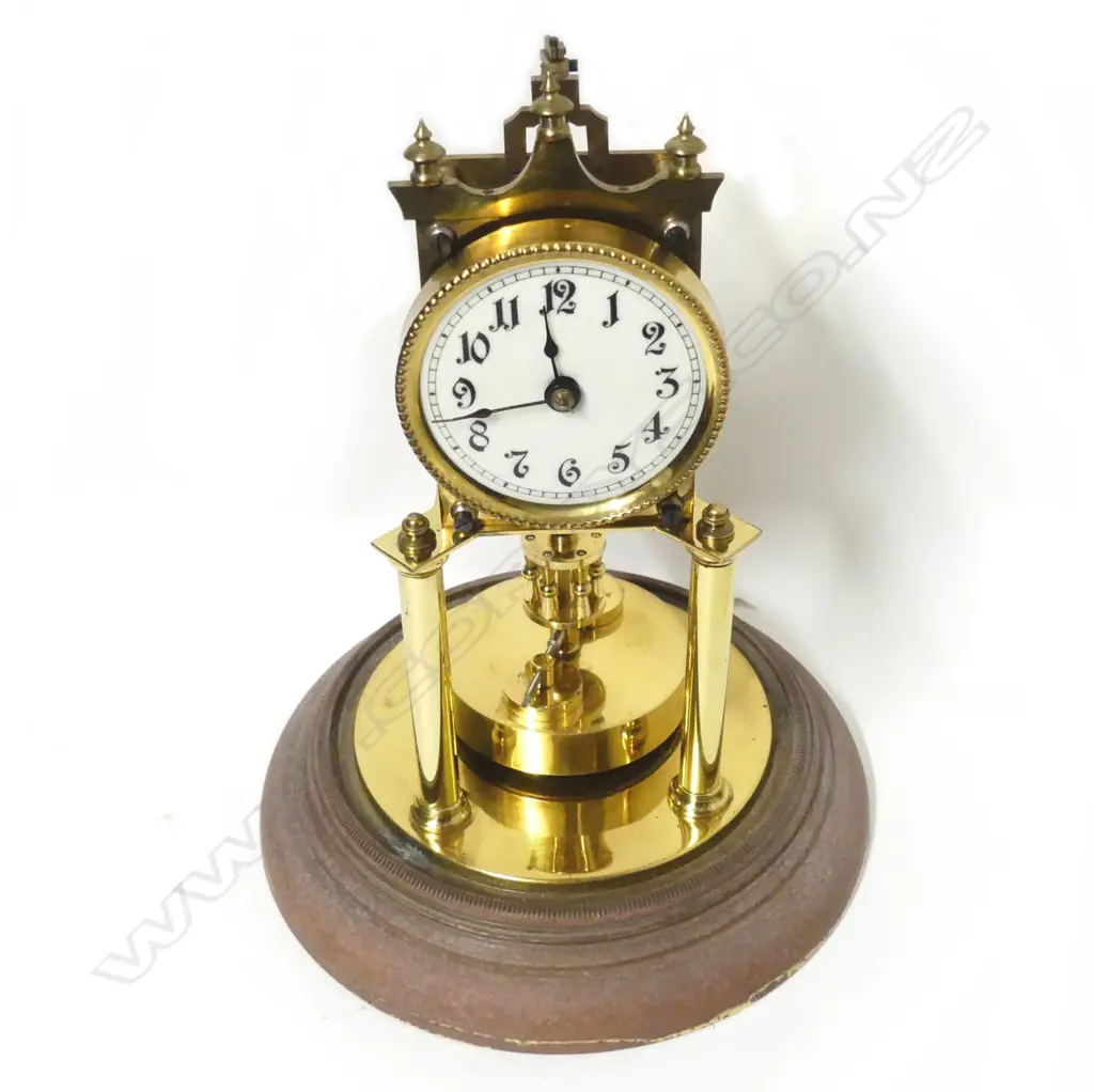 A brass 400-day torsion clock with glass dome Image 1++
