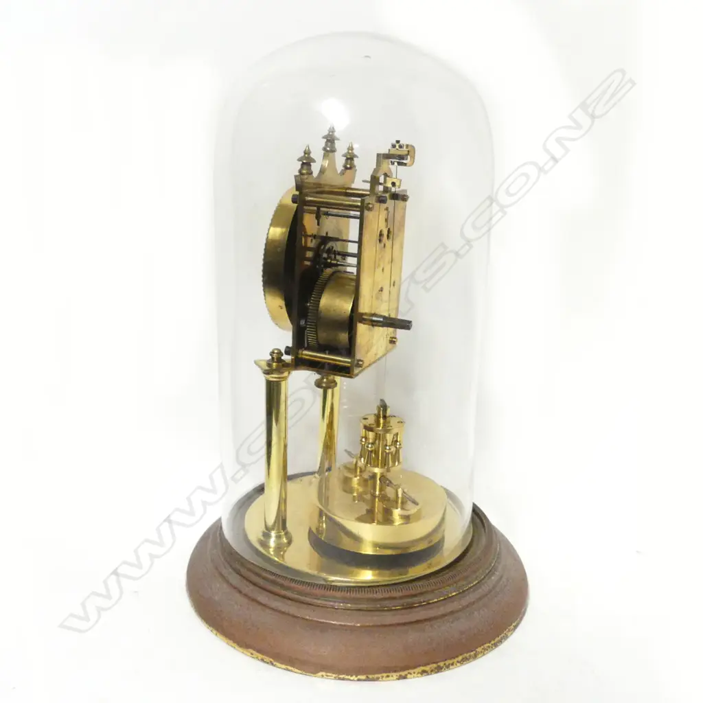 A brass 400-day torsion clock with glass dome Image 1++