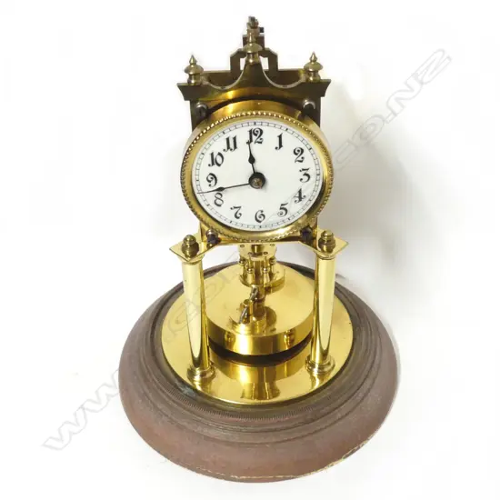 A brass 400-day torsion clock with glass dome
