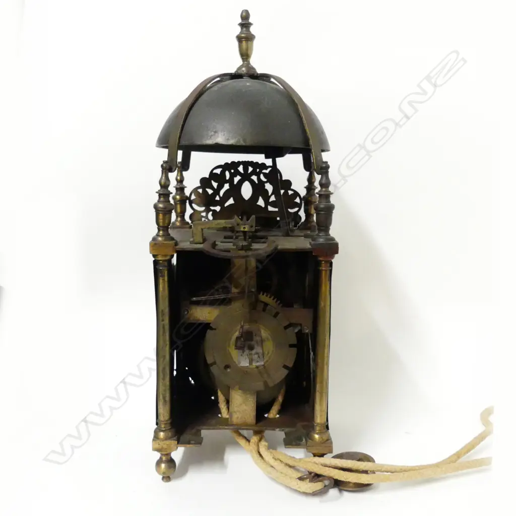 An early 18thC brass lantern clock by Robert Coster of Newbury with bell over dolphin fret and four urn finials Image 1++