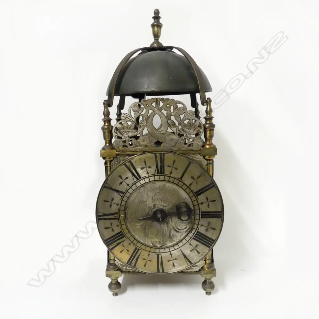 An early 18thC brass lantern clock by Robert Coster of Newbury with bell over dolphin fret and four urn finials Image 1++
