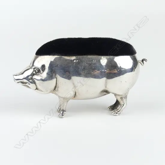 An Edwardian silver pig pin cushion