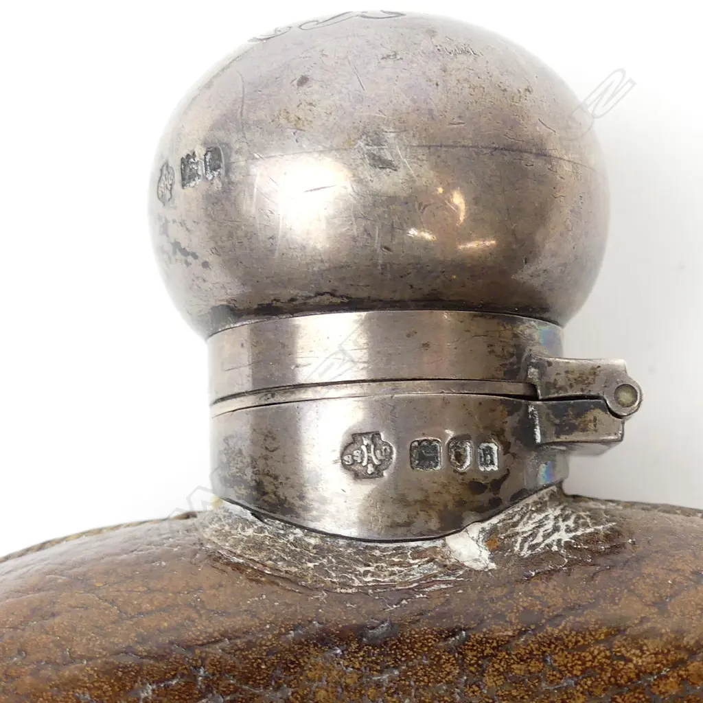 An Edwardian silver glass and leather gentleman's hip flask Image 1++