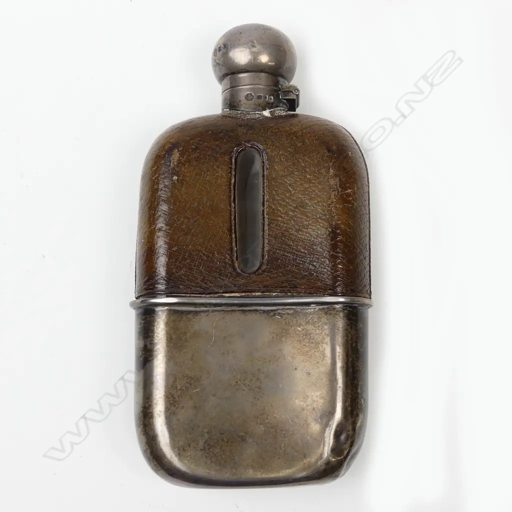An Edwardian silver glass and leather gentleman's hip flask Image 1++