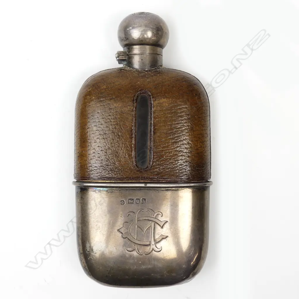 An Edwardian silver glass and leather gentleman's hip flask Image 1++