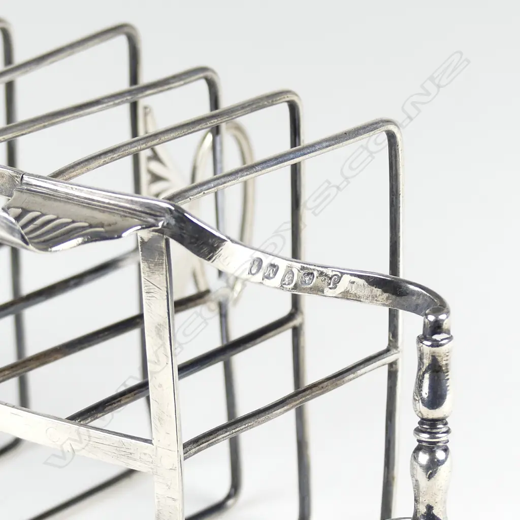 A Geo. III silver six slice toast rack Image 1++