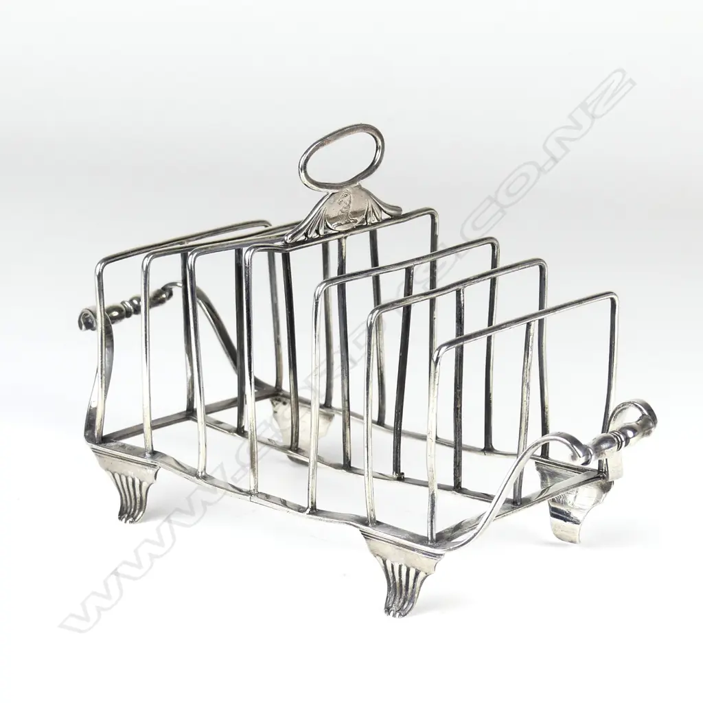 A Geo. III silver six slice toast rack Image 1++