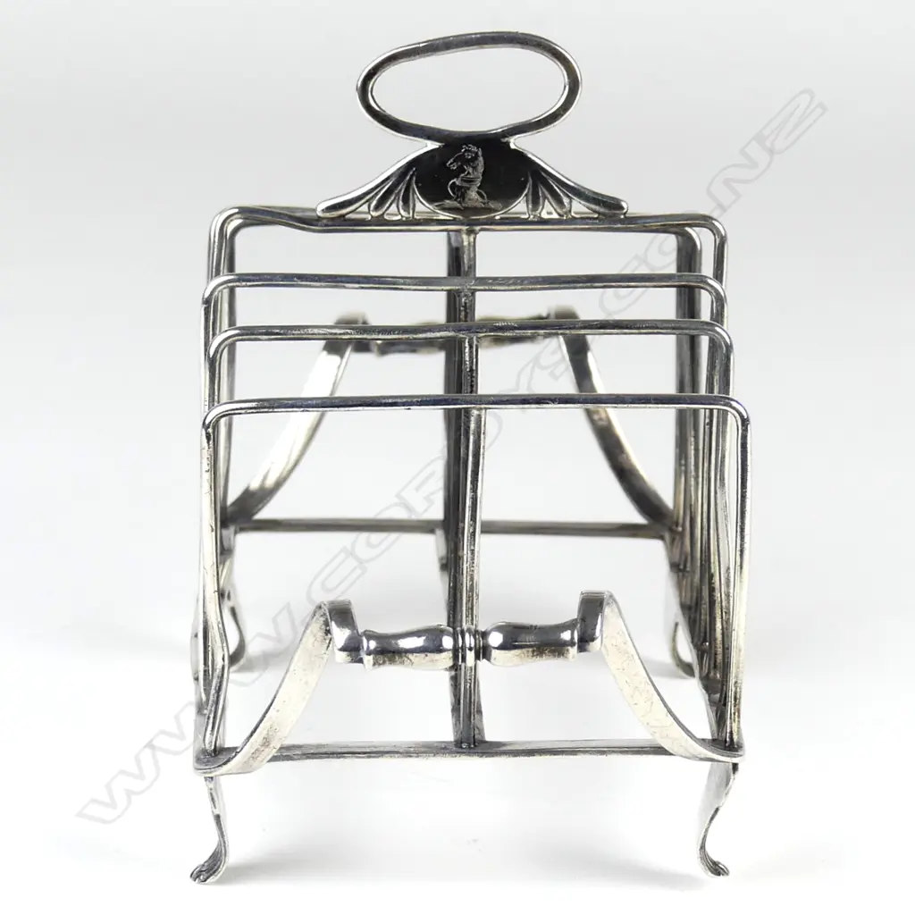 A Geo. III silver six slice toast rack Image 1++