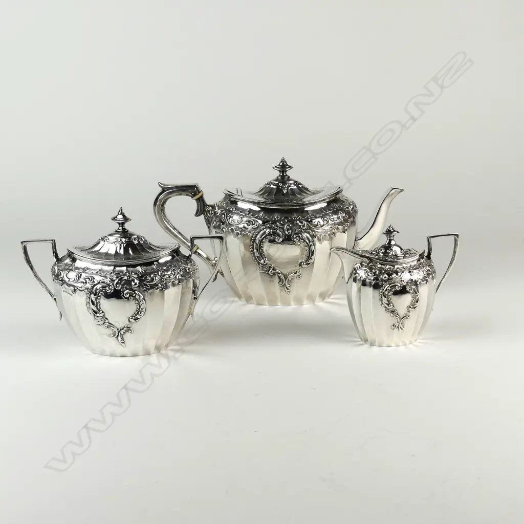 An Edwardian decorative silver three-piece tea service Image 1++