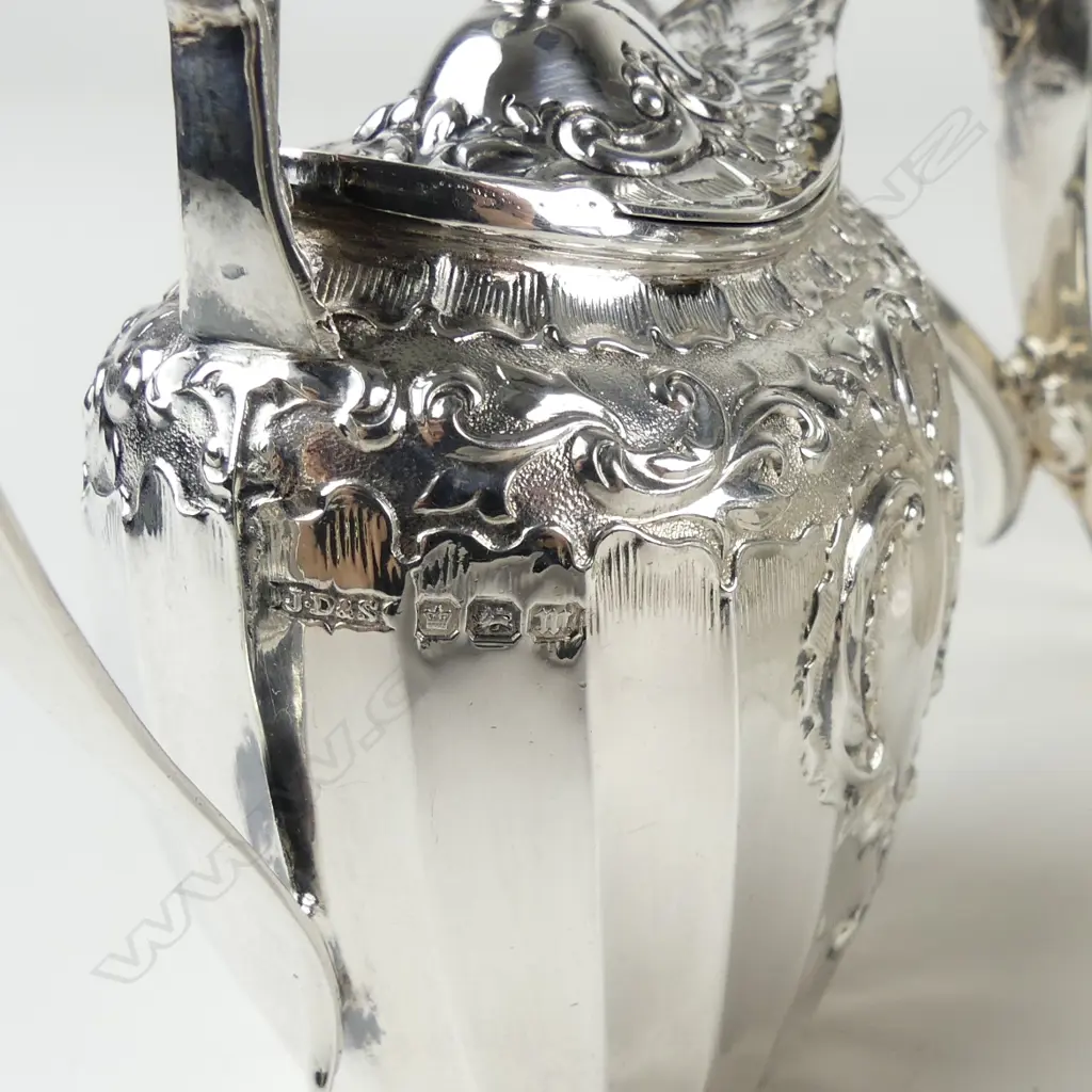 An Edwardian decorative silver three-piece tea service Image 1++