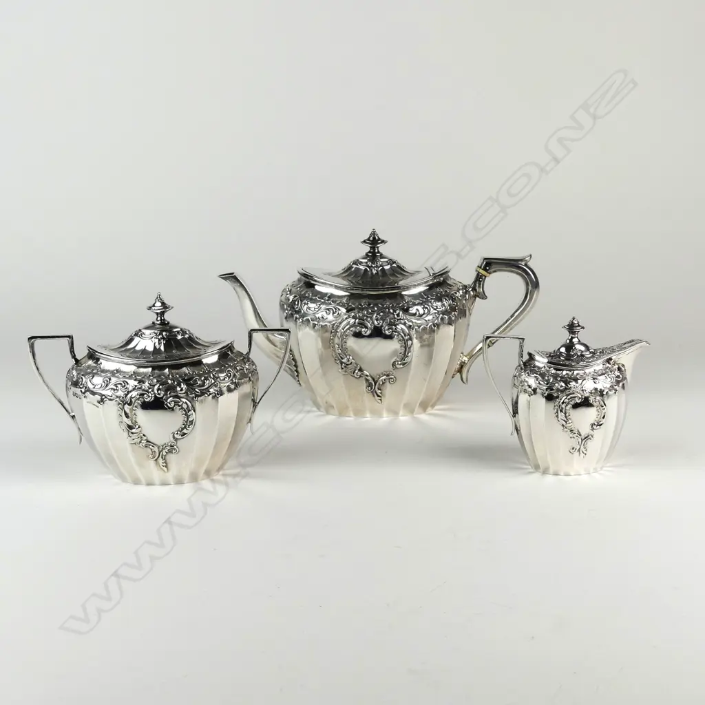 An Edwardian decorative silver three-piece tea service Image 1++