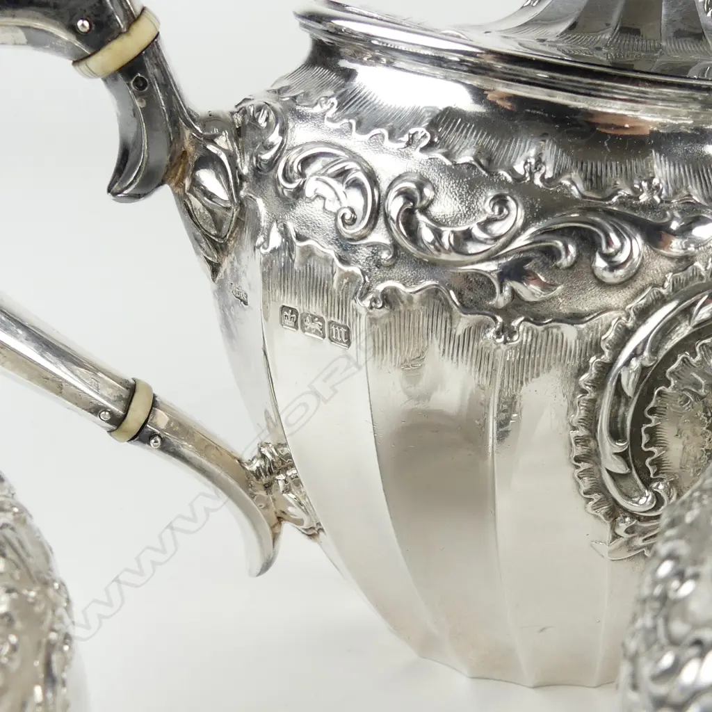 An Edwardian decorative silver three-piece tea service Image 1++