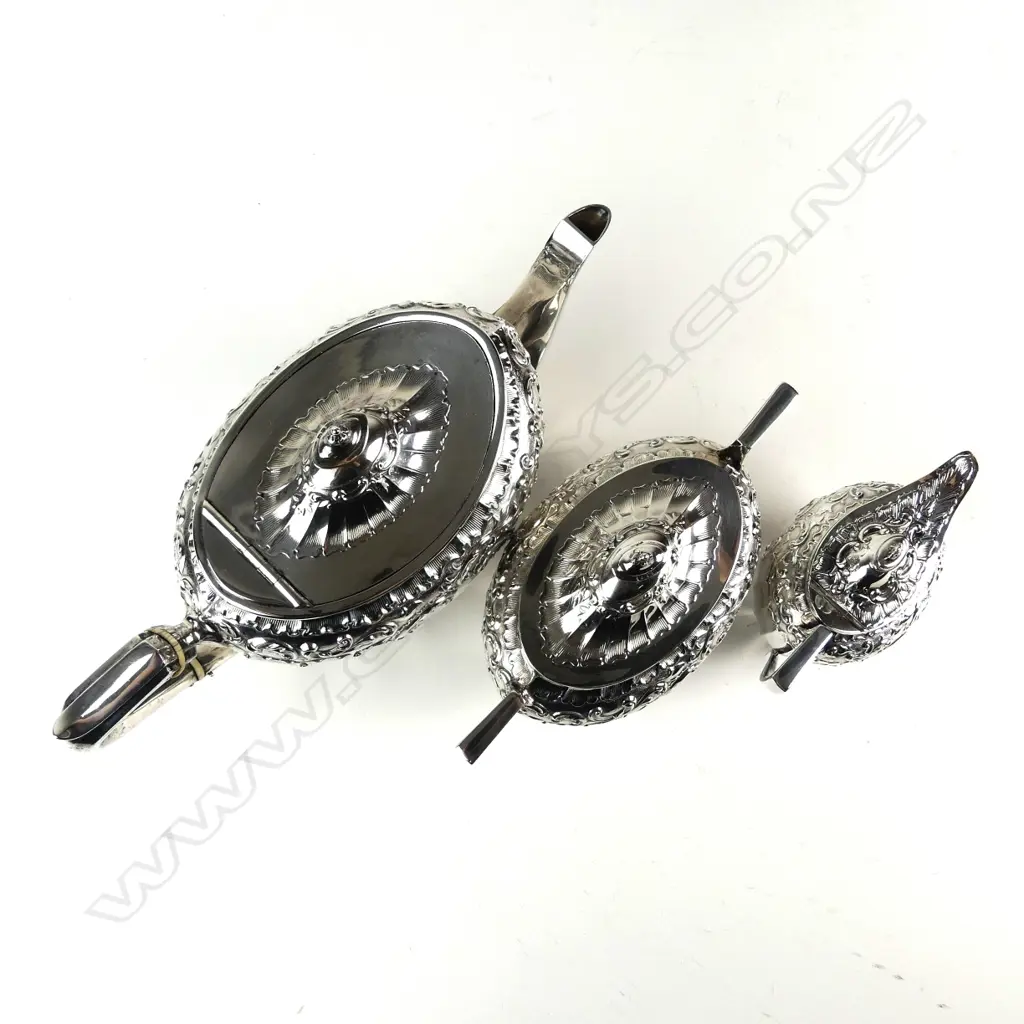 An Edwardian decorative silver three-piece tea service Image 1++