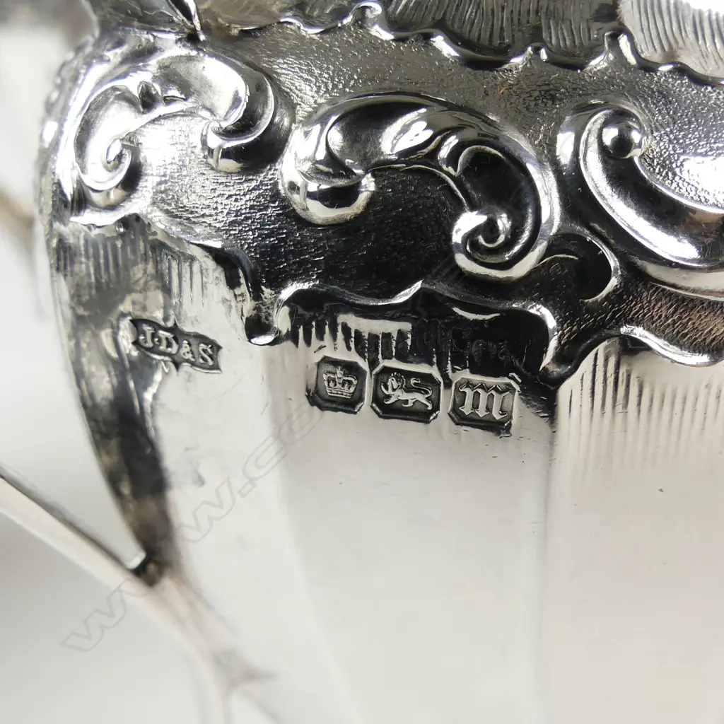 An Edwardian decorative silver three-piece tea service Image 1++