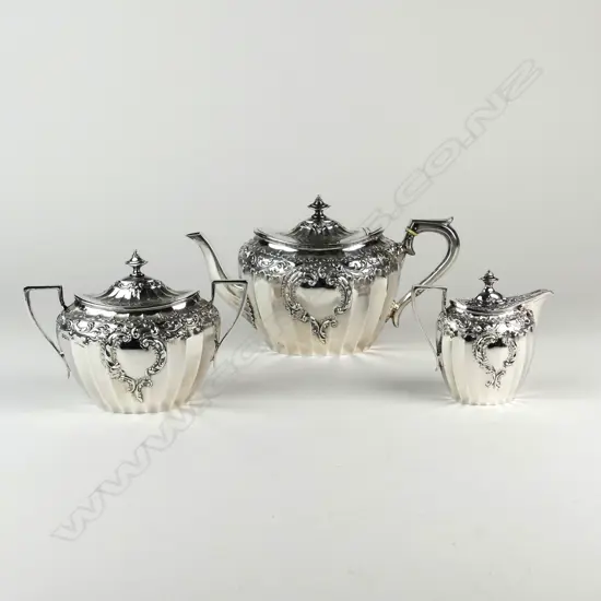 An Edwardian decorative silver three-piece tea service