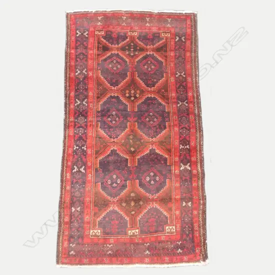 An antique hand knotted Baluchi rug