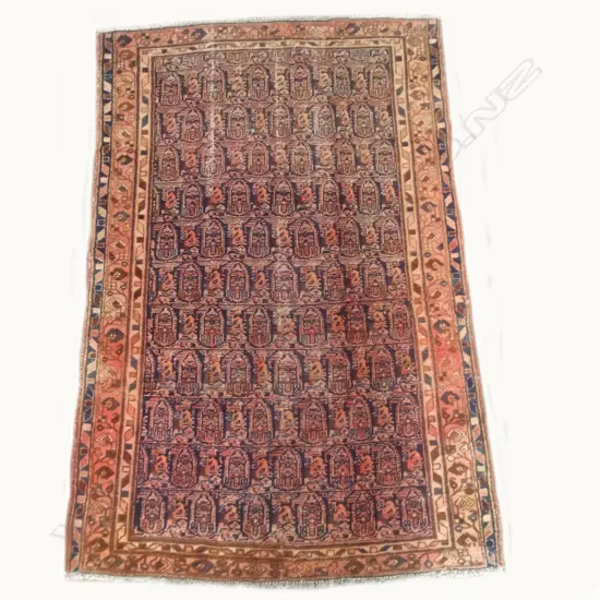 An antique hand knotted Iranian Qazvin rug