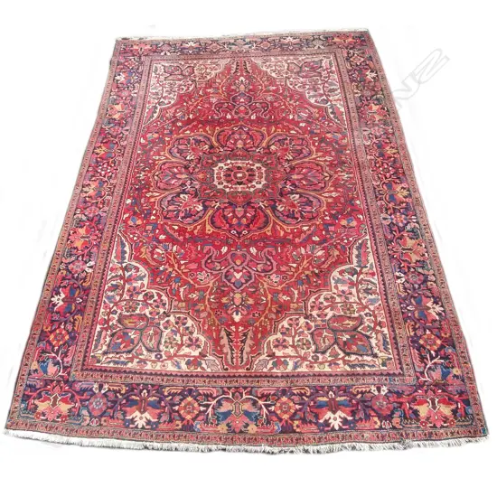 A large hand knotted Persian carpet