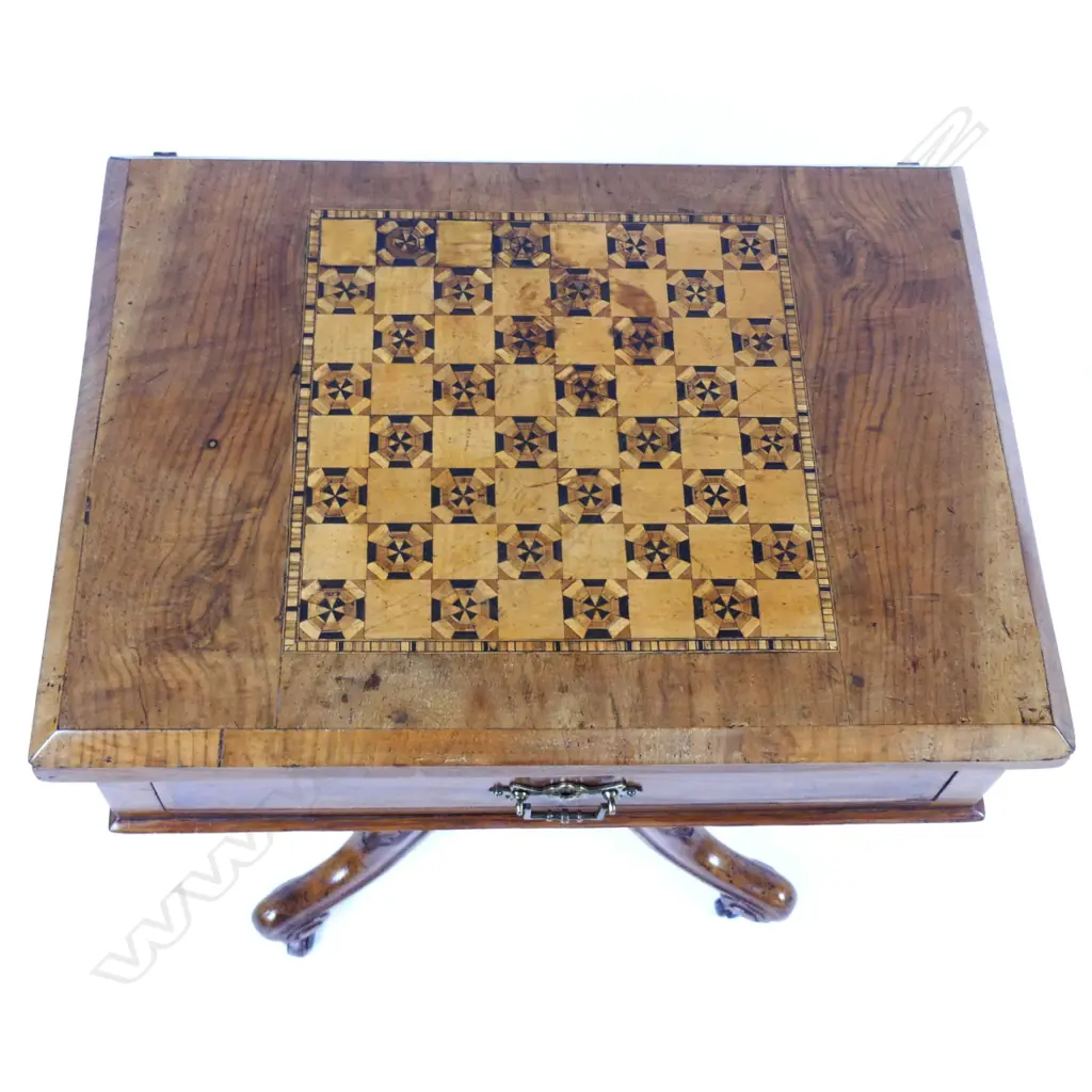 A Victorian walnut games table Image 1++