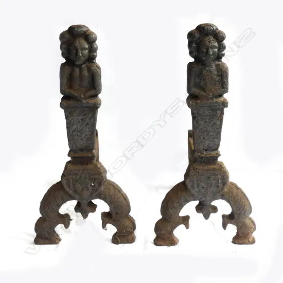 A pair of substantial 19thC cast iron fire dogs