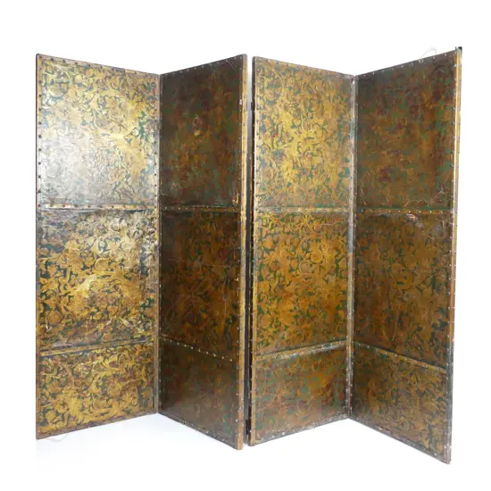 An early 1900s four fold leather screen