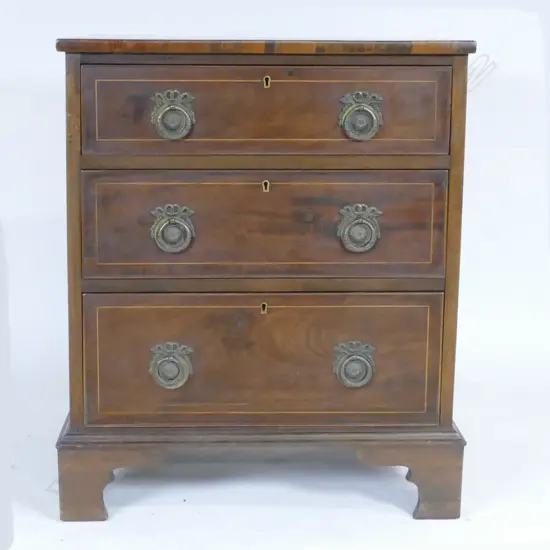 A small proportion Edwardian Sheraton Revival chest of three drawers