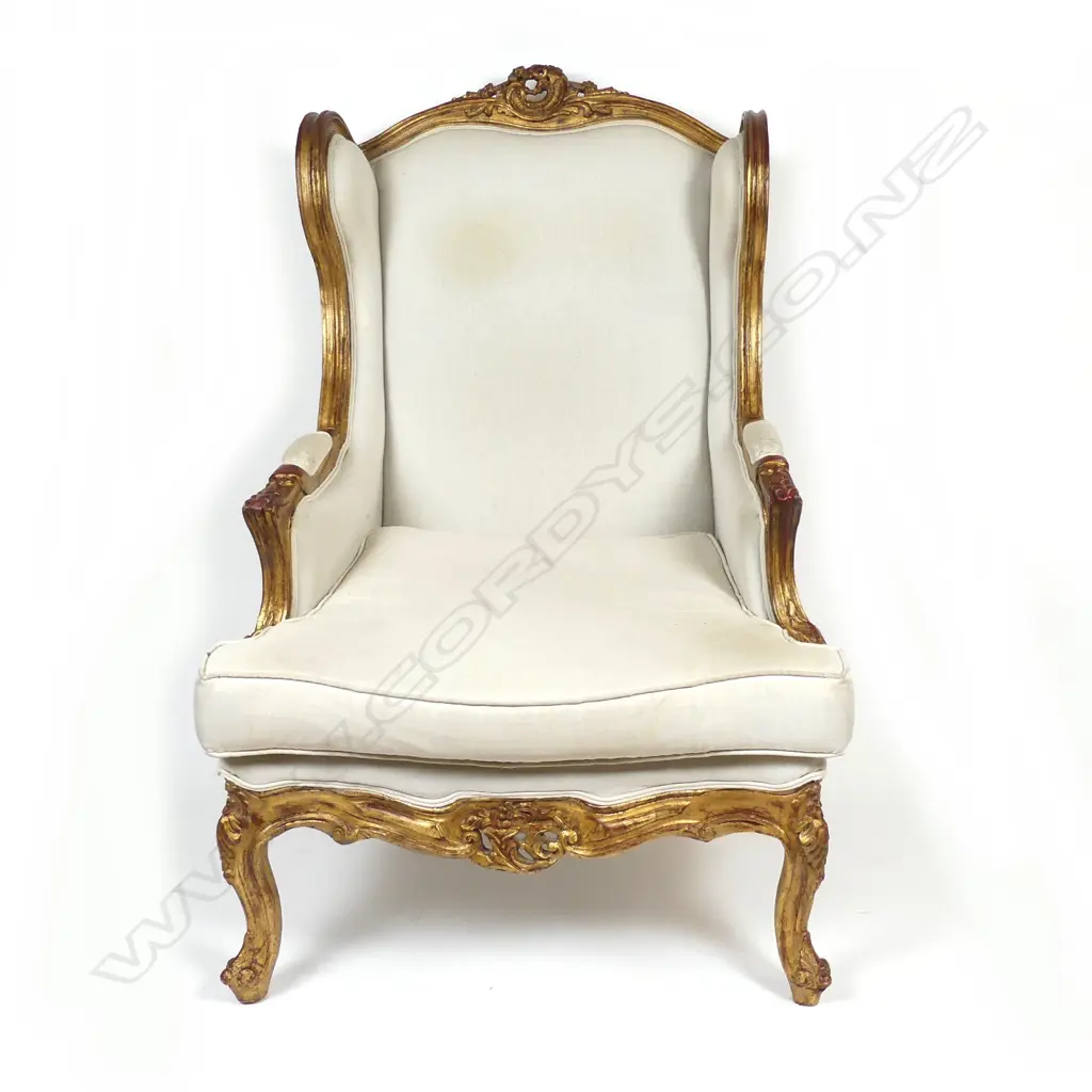 A Louis XVI style gilt wood framed bergère wing back chair Image 1++
