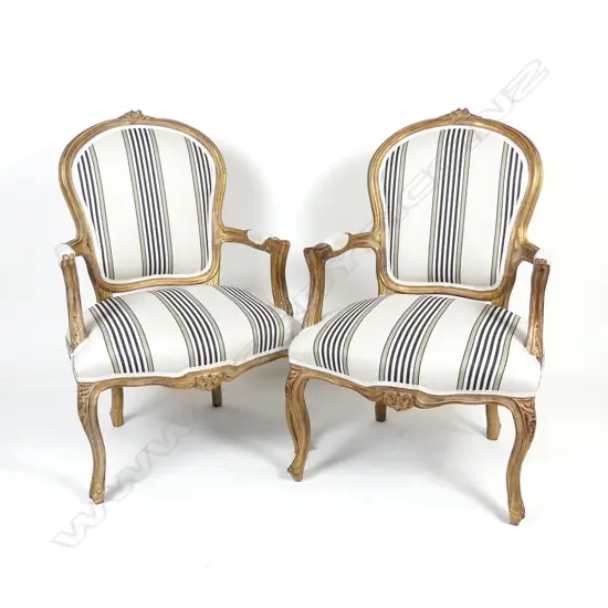 A pair of French style open elbow armchairs
