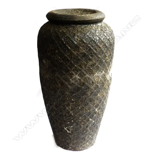 A tall glazed garden fountain water feature