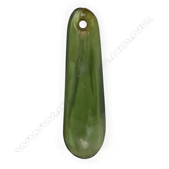 An old Māori pounamu kuru pendant,