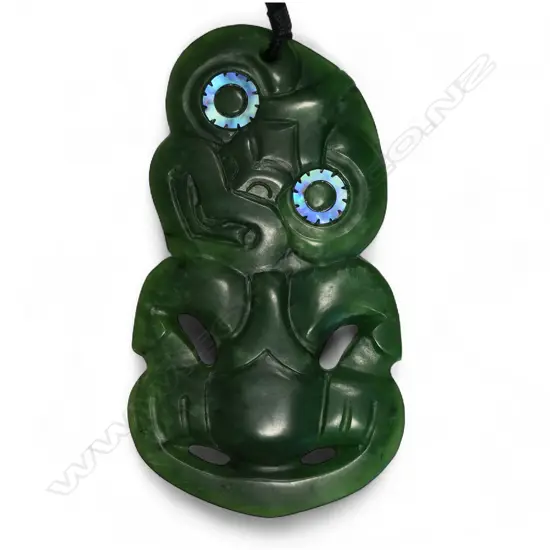 An uncommon modern Charlie Raponi Wilson carved Marsden Flower pounamu double sided hei tiki,