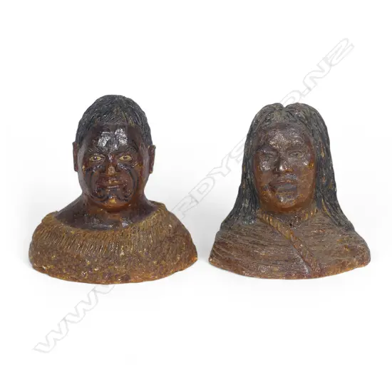 A pair of late 19thC large carved kauri gum busts of a Māori chief and chieftainess, naturalistically represented with black staining to their hair and moko, both represented with a muka cloak wrapped to their shoulders. Minor chipping to edges. H's.105mm. Provenance: From the John Perry estate.