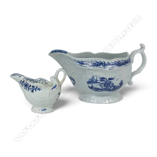 Two George III blue and white sauce jugs,