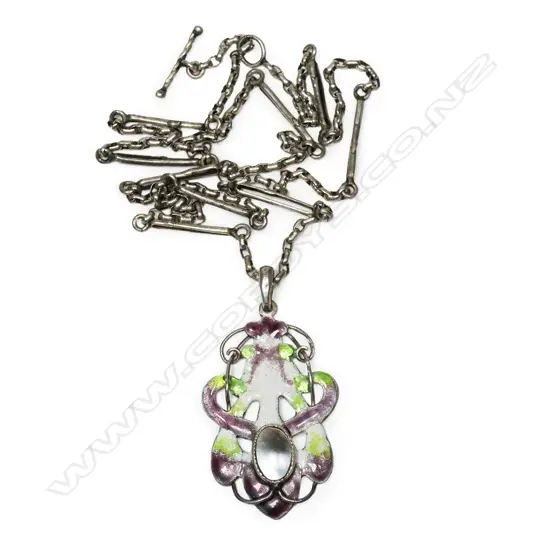 A rare New Zealand Arts & Crafts silver enamel and mother of pearl 'suffragist' pendant,