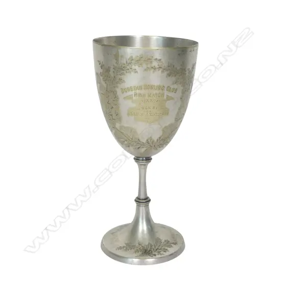 A late 19thC New Zealand historical silver plate trophy cup, presentation engraved ' Dunedin Bowling Club Rink Match 1887 Won By James Anderson. The front engraved with a bowling scene. The plating worn. H.210mm.