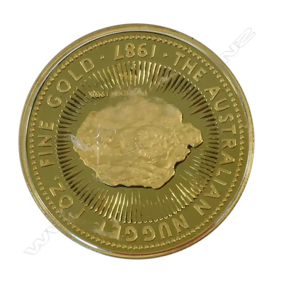 A gold 100 dollar coin ‘The Australian Nugget 1987’,