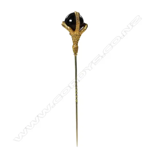 A Victorian 15ct gold claw set garnet ball stick pin,