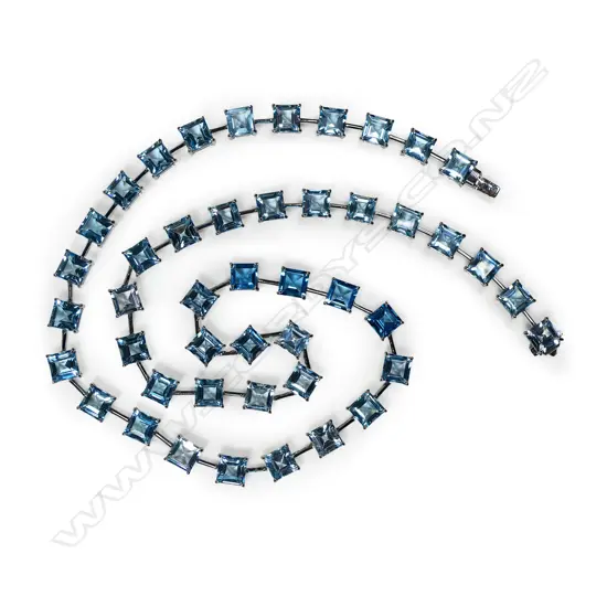 A 9ct white gold and blue topaz necklace,