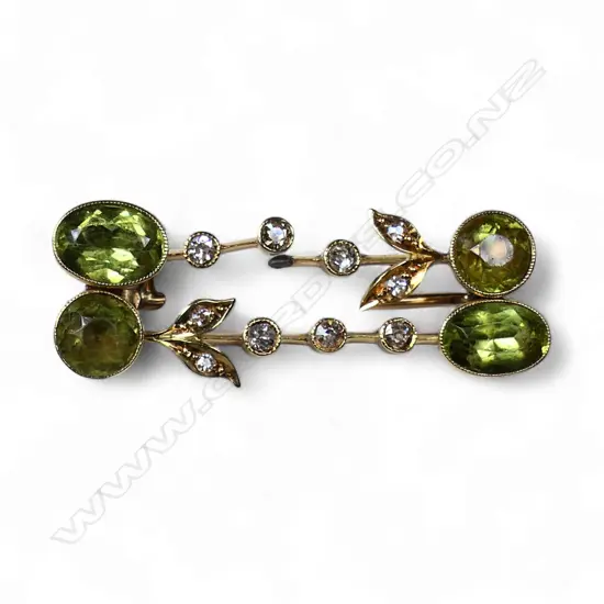 An Edwardian peridot and diamond double bar brooch,