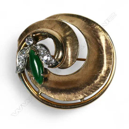 A 1940's /1950's American 14ct gold diamond and jadeite swirl brooch,