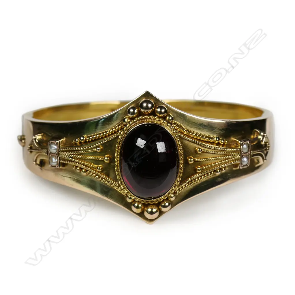 A Victorian Etruscan revival 15ct gold cabochon garnet hinged bangle, Image 1++