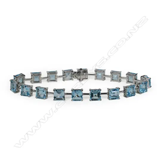 A 9ct white gold and blue topaz bracelet,