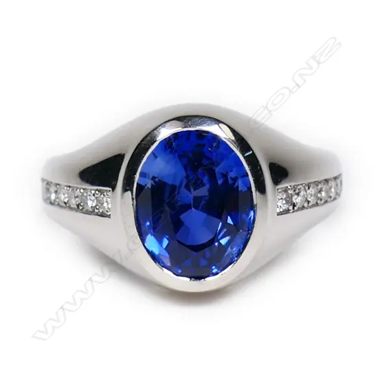 A bespoke Julian Bartrom platinum sapphire and diamond ring,
