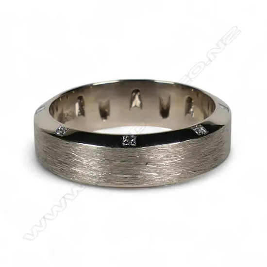 A gent's bespoke handmade 18ct white gold and diamond set wedder,
