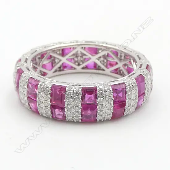 An 18ct white gold diamond and pink sapphire ring,