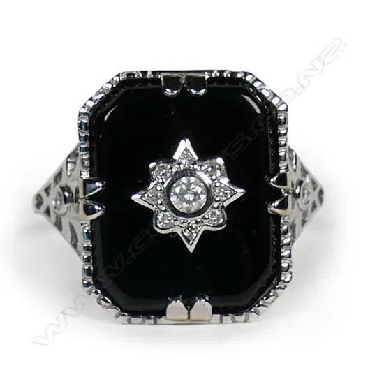 A 14ct white gold onyx and diamond Art Deco style ring,