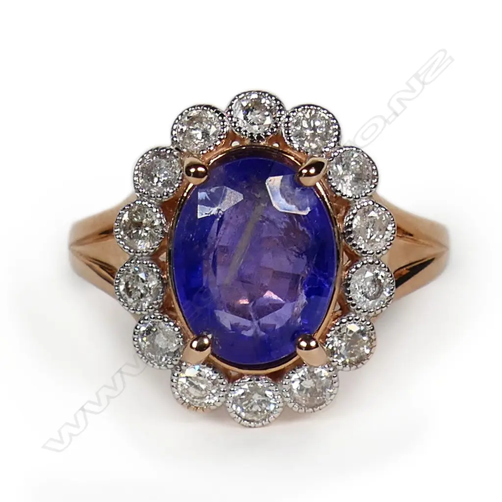 A 14ct rose gold tanzanite and diamond halo ring, Image 1++