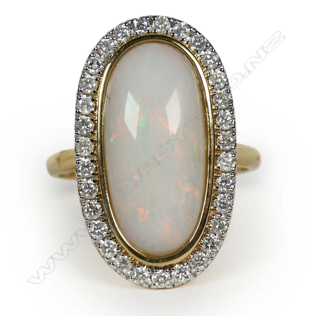 A 14ct gold opal and diamond halo ring, Image 1++